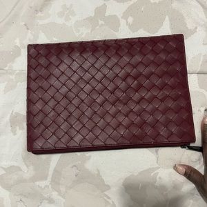 Bottega Veneta large burgundy wristlet.